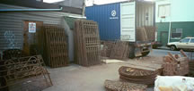 Unloading a container of wrought iron